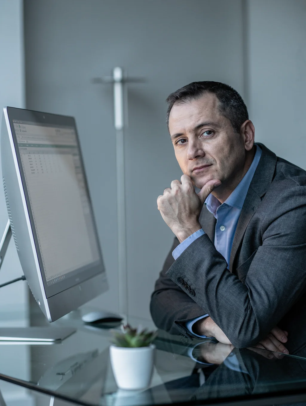 Portrait of David, an entrepreneur reflecting in a quiet space